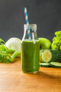 Green smoothie with fresh fruits and vegetables